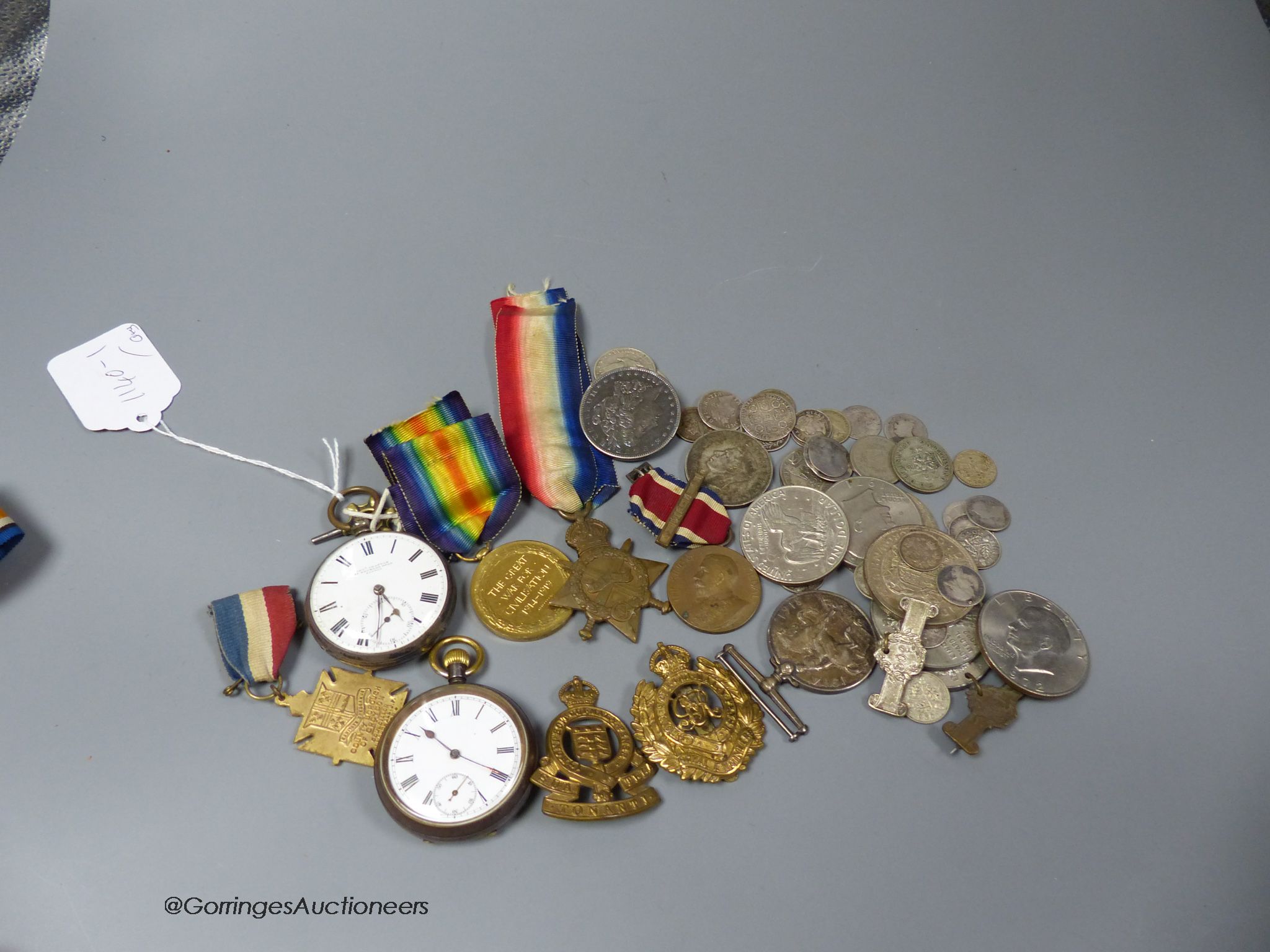 A 1562 shilling and other assorted coinage, two pocket watches and a group of mixed medals including a WWI trio.